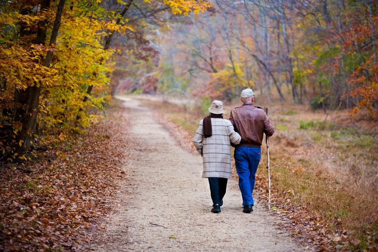 Couple walking along a road