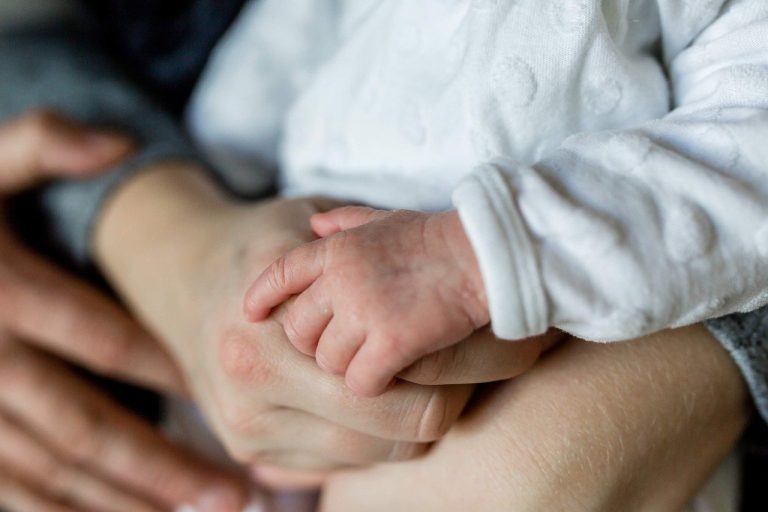 Parent and child holding hands