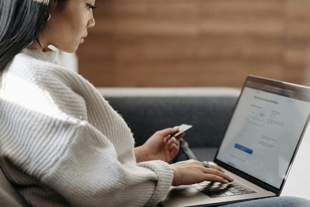 A person looking at a laptop.